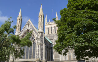 Great Yarmouth Minster’s stone and flint exterior, with its large circular window.