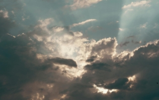 Sunbeams breaking through dramatic clouds in the sky